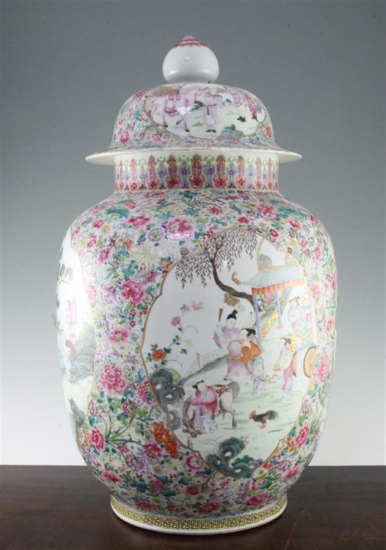 A massive famille rose millefleur ground ovoid vase and cover, Qianlong period, 64cm, broken and repaired, chip to cover